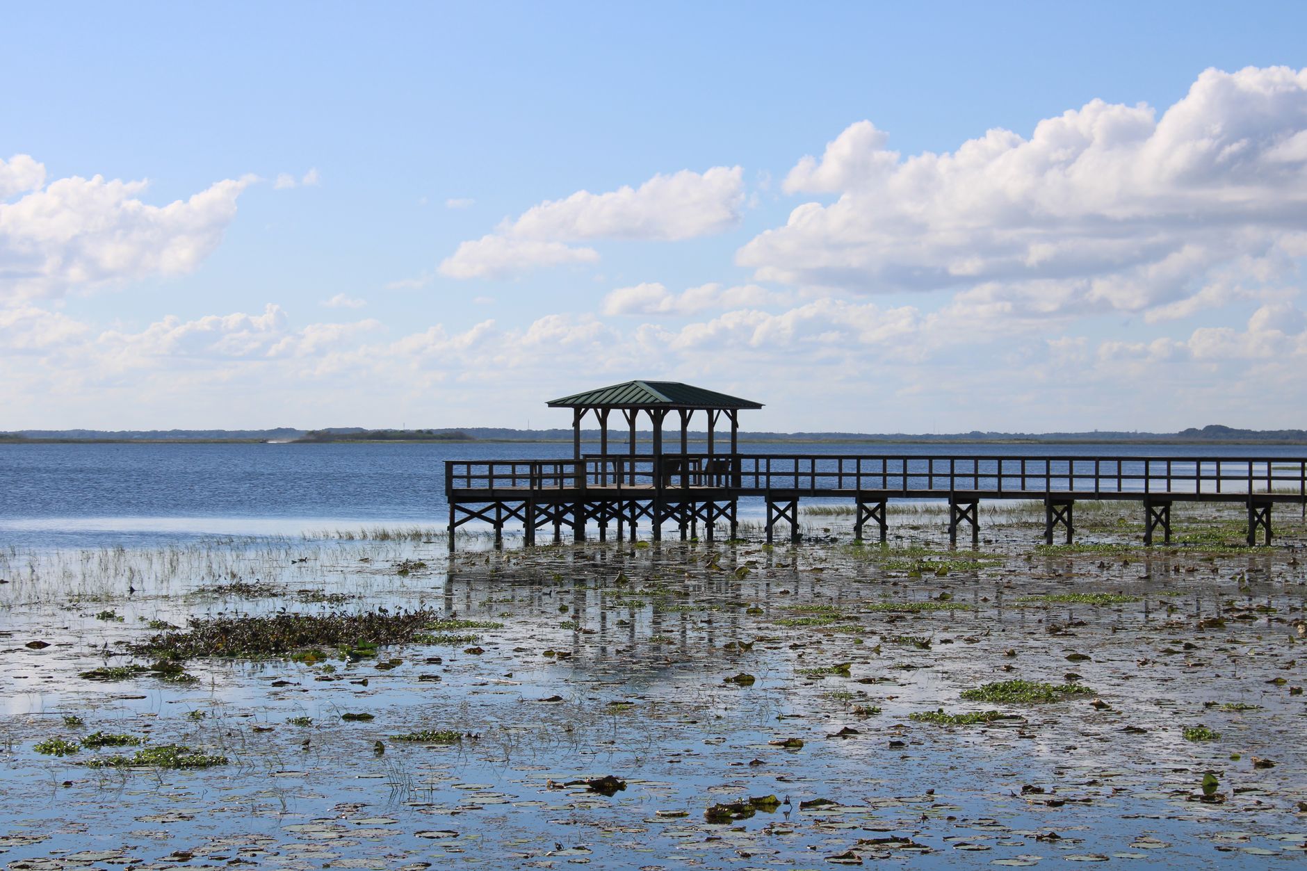 Boardwalk along the lakeshore under incoming weather