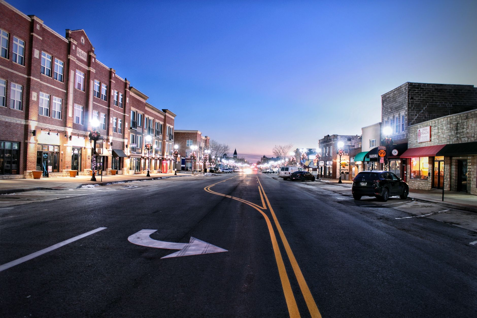 Small-town main street storefronts at golden hour
